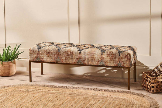 Nkuku Kesu Kilim and iron bench in natural finish, showcasing a stylish and sturdy bench with woven kilim seat and metal frame.