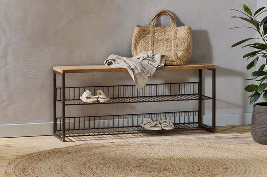 Nkuku Kiyoma iron and wood low standing shelves in natural finish, showcasing a modern, minimalist shelving unit for home storage.