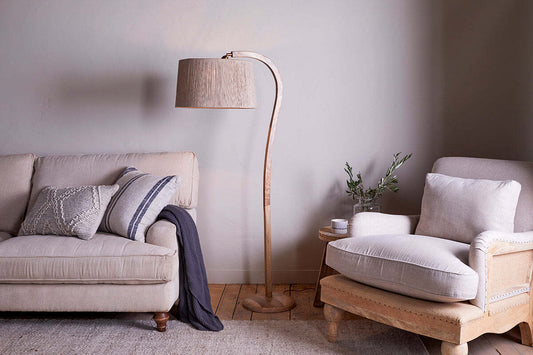 Natural mango wood floor lamp base by Nkuku, showcasing smooth, warm-toned wood with a sturdy, elegant design.