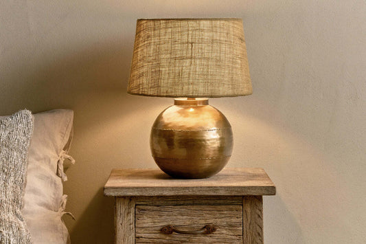 Rasan table lamp base in antique brass with a sleek, modern design, perfect for contemporary home decor.