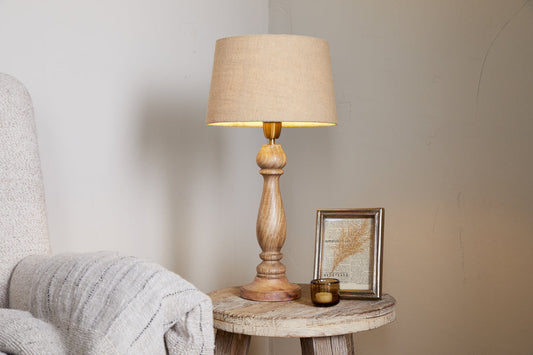 Large Usha Classic Wooden Table Lamp base in natural finish by Nkuku, showcasing elegant wooden craftsmanship for stylish lighting.